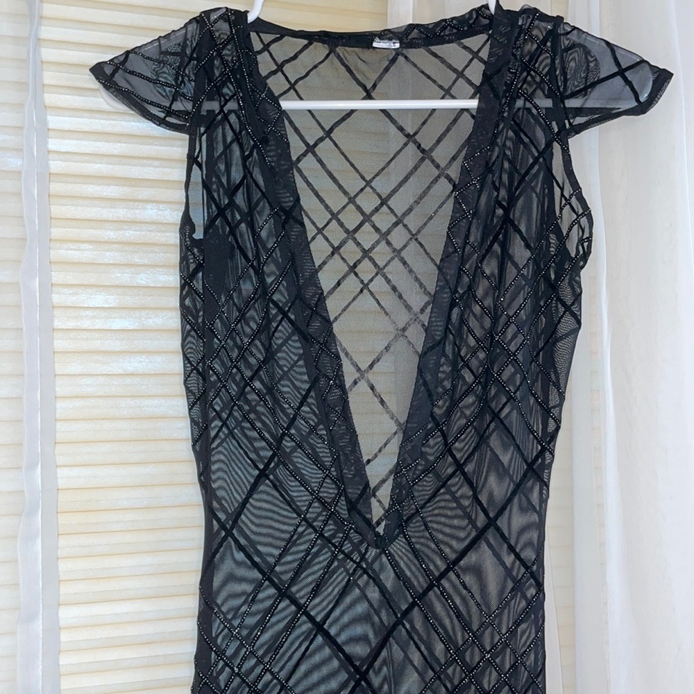 Black see through gown with glitter.